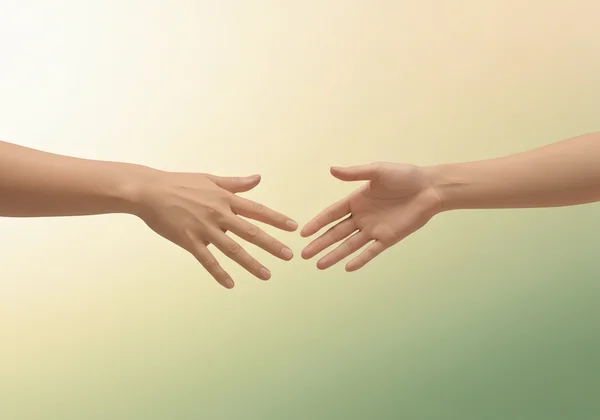 Two hands meeting, symbolizing mental health professional support.